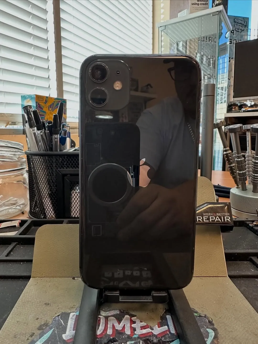 iPhone 11 with restored black back glass after repair